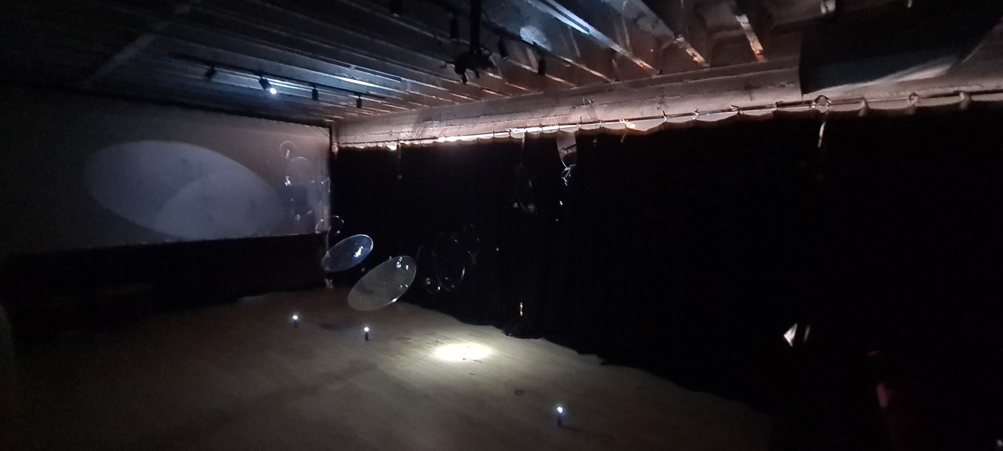 Art installation with glass discs and light